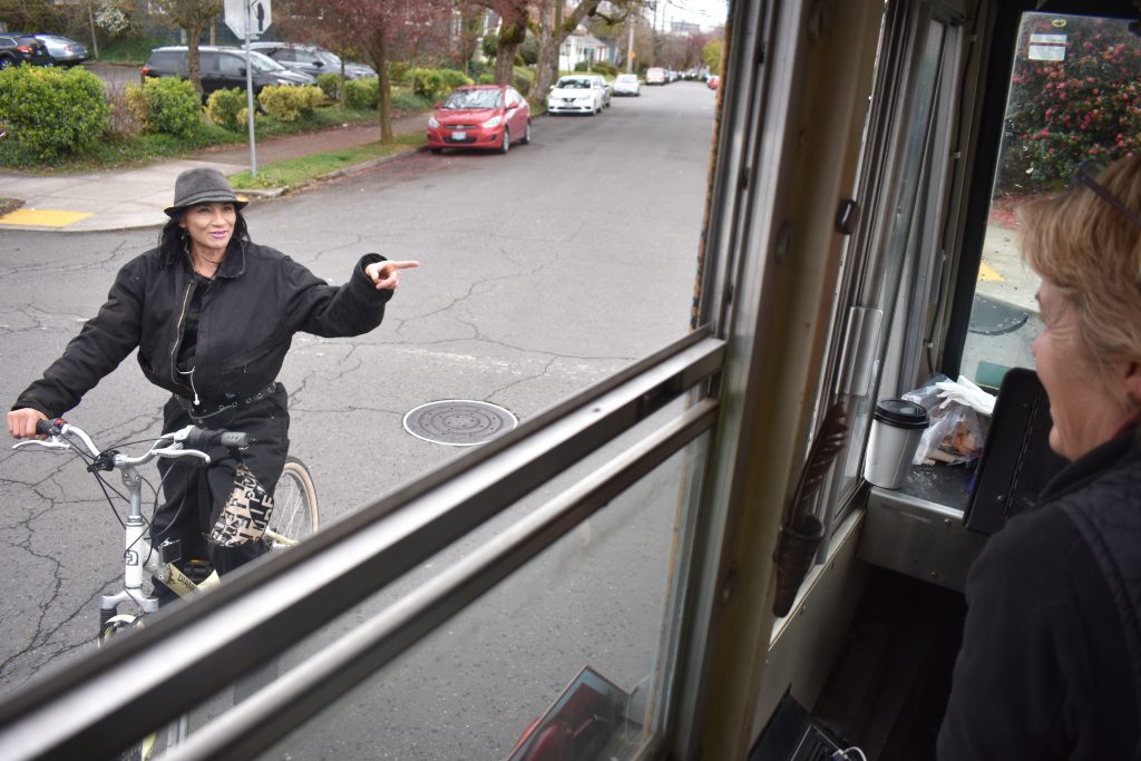 A passerby, Monique, chats with Meg Vogt, whose creative thinking led to the dog bus in Portland, Oregon. (Image © Joyce McGreevy)