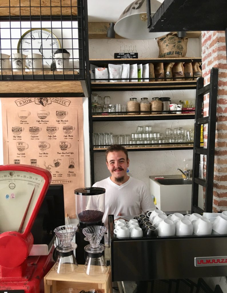 A barista in Plovdiv, Bulgaria exemplifies how global citizens interact in linguistic landscapes. (Image © Joyce McGreevy)