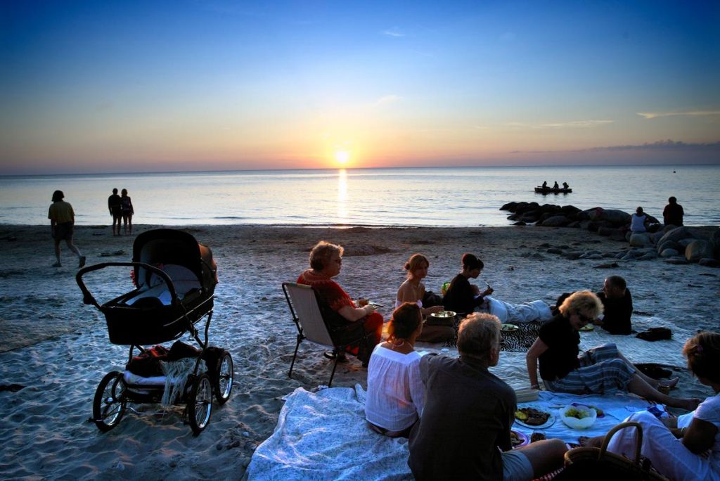 People of all ages gathered on Denmark's Tisvilde Beach exemplify global citizens' shared experiences. (Image © Christian Alsing and Visit Copenhagen) 