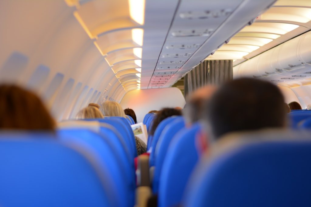 A crowded commercial airline interior evokes the need for aviation innovations and creative problem solving. [Image public domain]