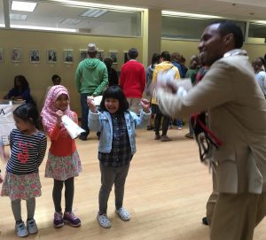 Students and a dance instructor at the Embassy of Ethiopia, Washington, DC, reflect the enthusiasm for crossing cultures at Passport DC. (Image © Joyce McGreevy)