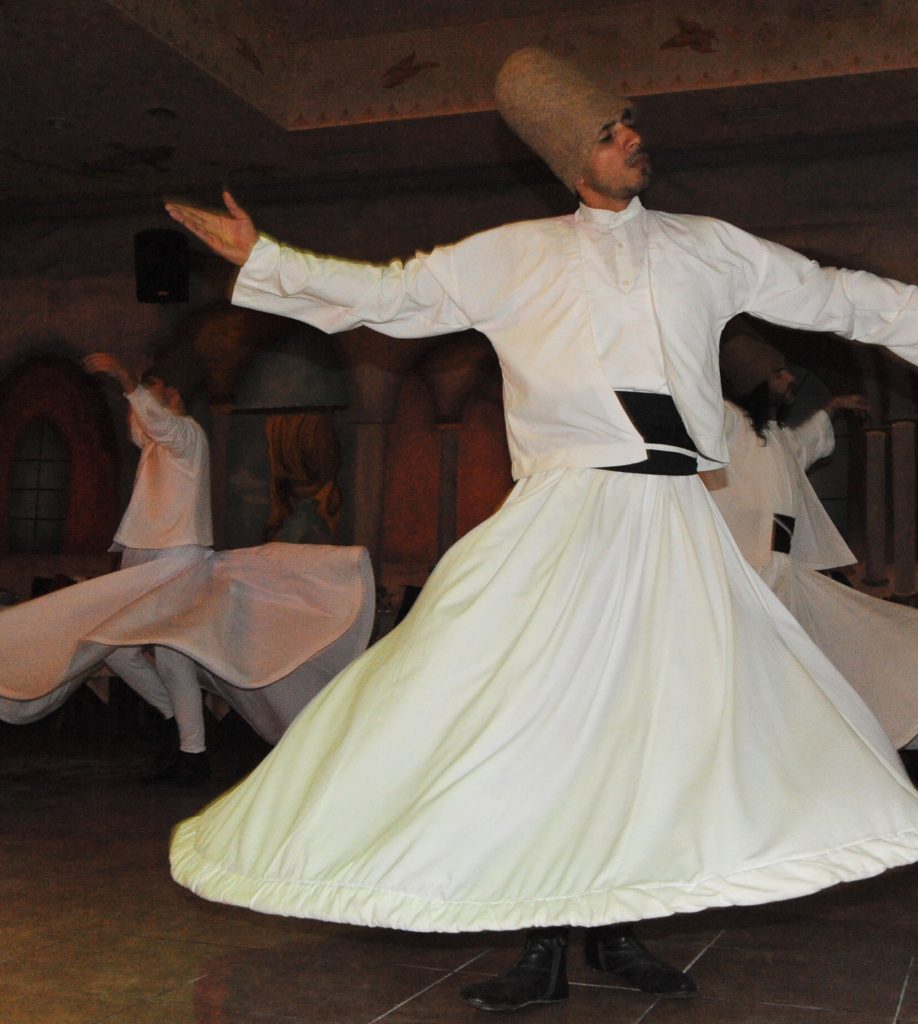 Whirling dervishes dance in the Sufi Sema ceremony in Istanbul. (Image © Meredith Mullins)