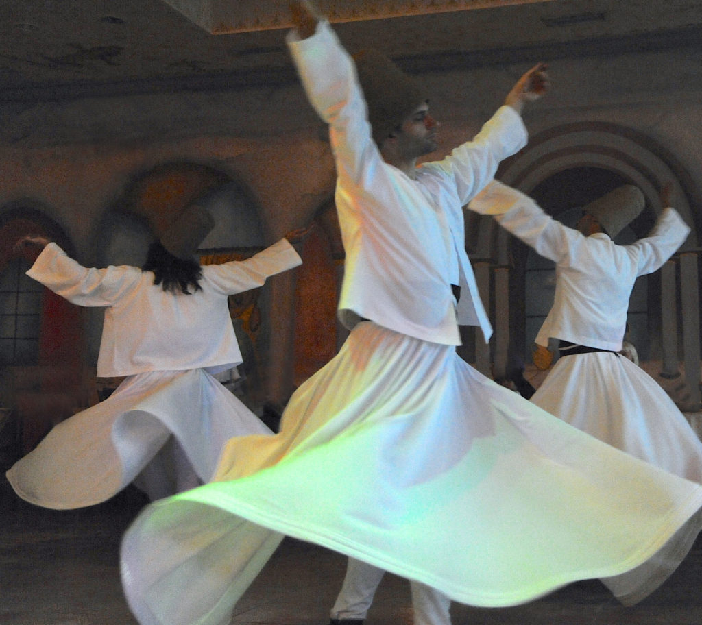 Whirling dervishes dance in the Sufi Sema ceremony in Istanbul. (Image © Meredith Mullins)