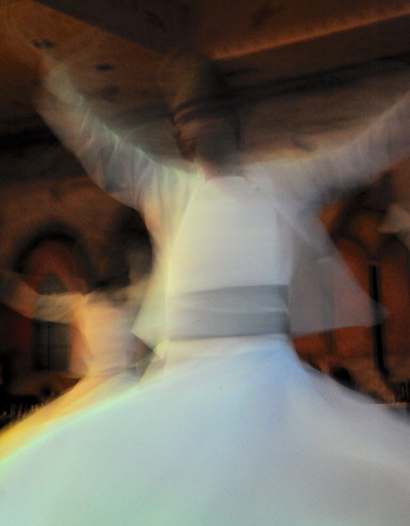 Whirling dervishes dance in the Sufi Sema ceremony in Istanbul. (Image © Meredith Mullins)