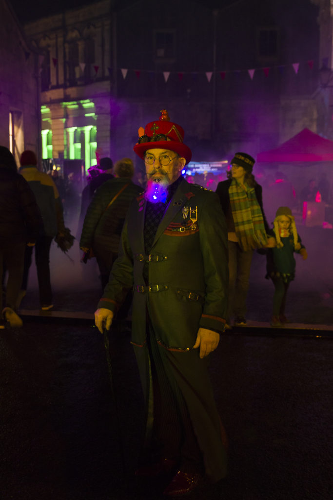 A man in glowing beard and costume reflects the Victorian cultural heritage and creative thinking of Steampunk Festival NZ in Oamaru, New Zealand. (Image © Malcolm and Annette. Whyte / M&A Whyte Photography ) 