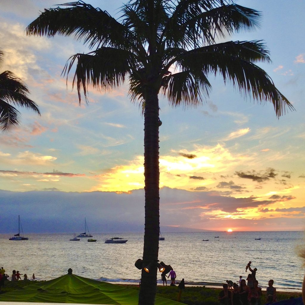 A beach at sunset in Maui evokes the art of travel as a digital nomad. (Image © Joyce McGreevy)