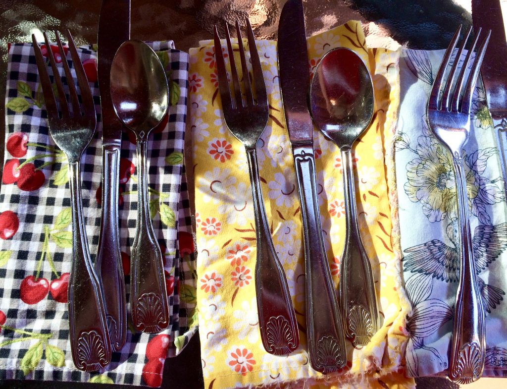 Cutlery and napkins symbolize the domestic pleasures that make an art of travel as a vagabond homebody or digital nomad. (Image © Joyce McGreevy)