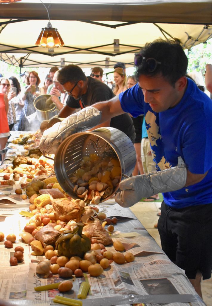 People at a community supper reflect how each of us can make a difference when we share with others. (Image © Joyce McGreevy)