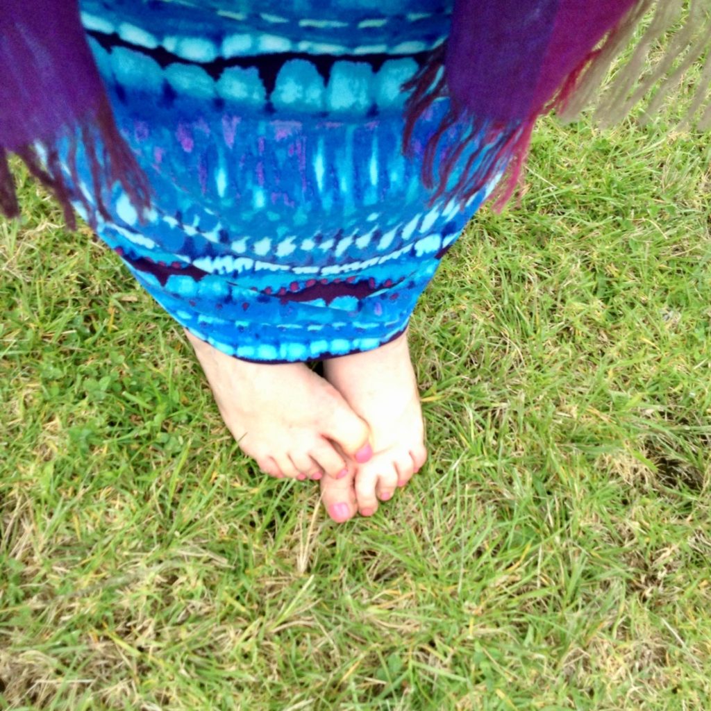 Bare feet on grass suggest the pleasure of savoring summer. (Image @ Joyce McGreevy)