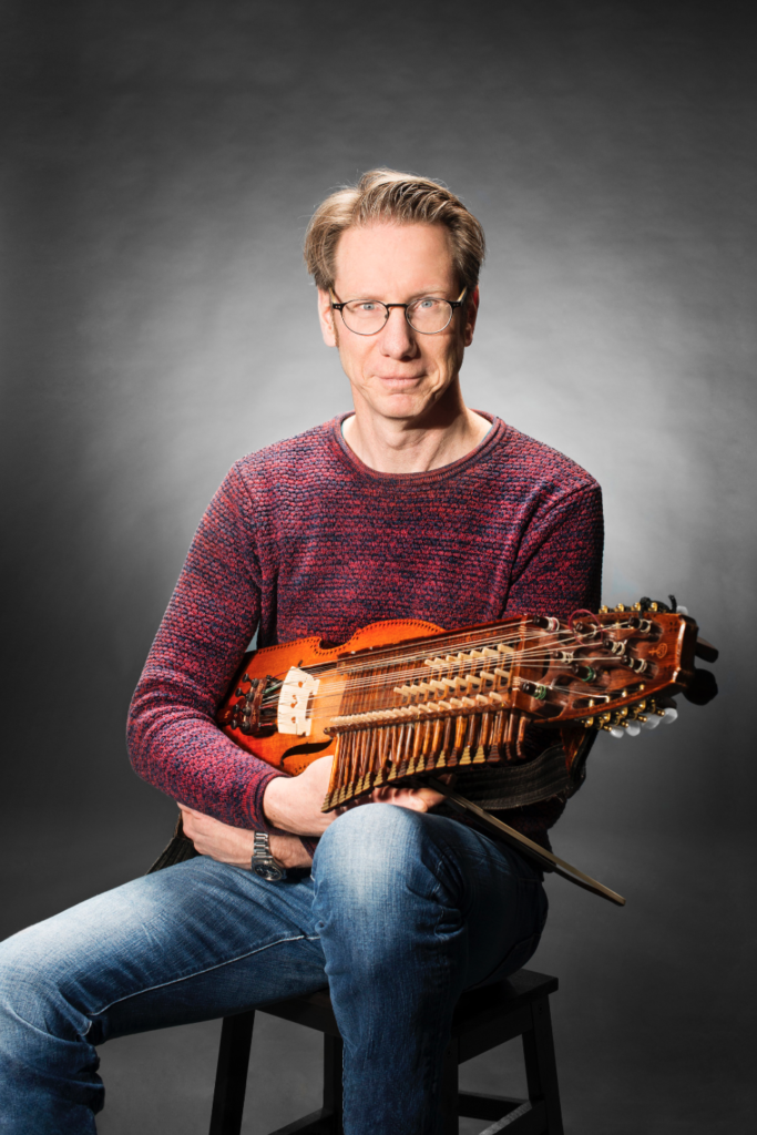 Olav Johansson with his nyckelharpa, showing the cultural traditions of Sweden. (Image © Sarah Thorén.)