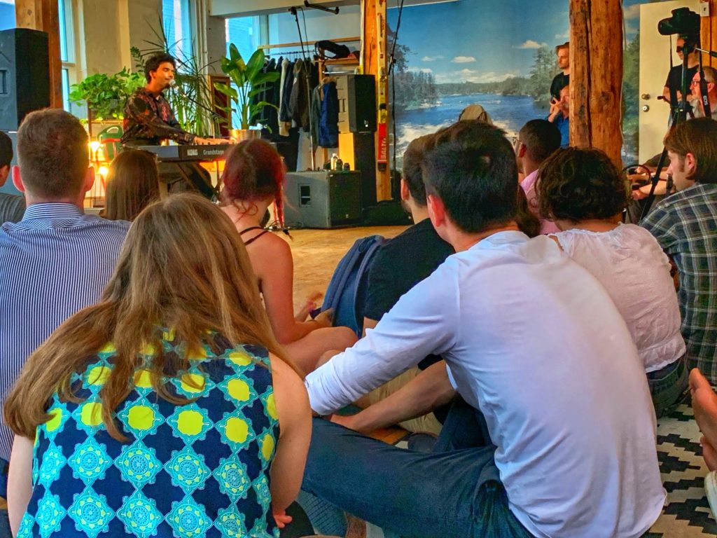 A diverse audience gathers for a Sofar Sounds concert of international musicians in Montreal, Canada, proof that traveling the world musically connects cultures. (Image © Joyce McGreevy)