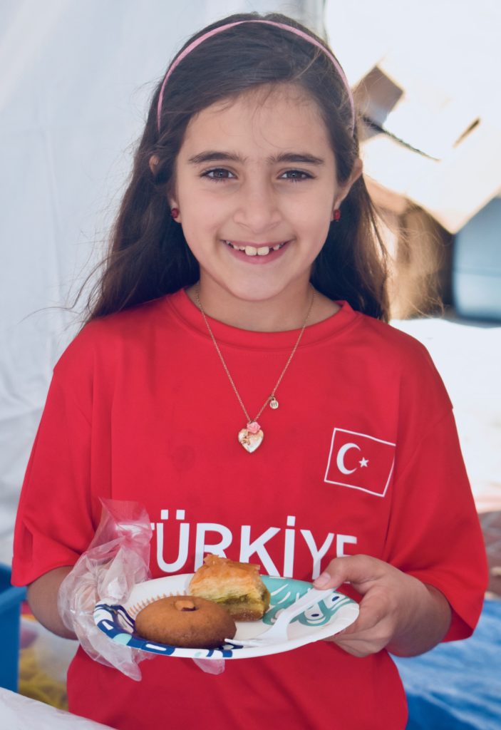 A young Turkish American girl celebrates her heritage at the Turkish Arts and Culture Festival in Monterey, California. (Image © Joyce McGreevy)