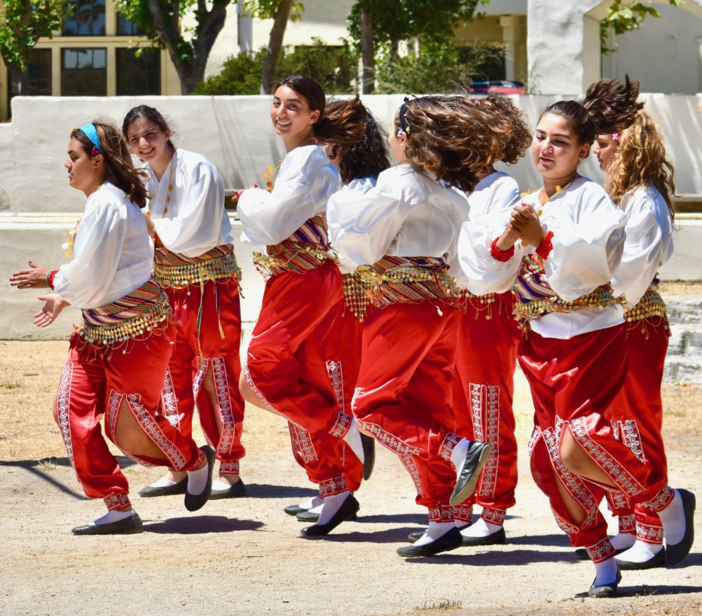 Young women at the Turkish Arts and Culture Festival in Monterey, California reflect the exuberance of Turkish line dancing and inspire memories of Istanbul. (Image © Joyce McGreevy)