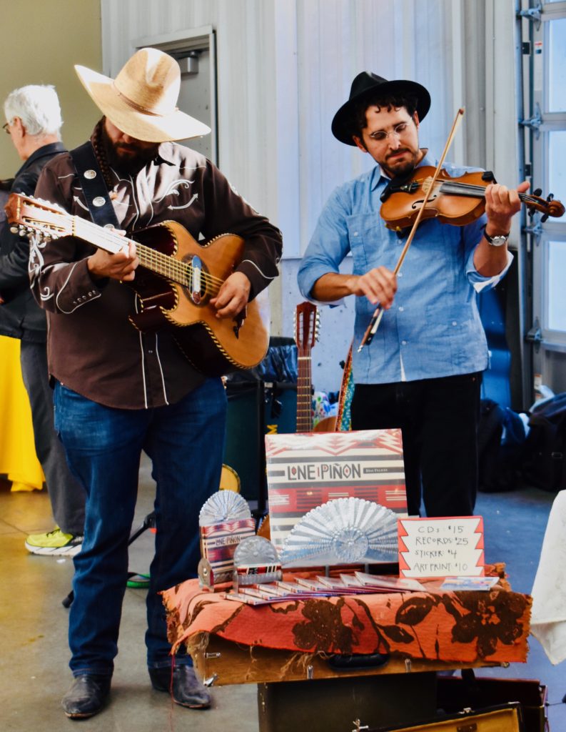 Musicians from the Santa Fe New Mexico band Lone Pinon reflect the importance of the arts at American farmers markets. (Image © Joyce McGreevy)