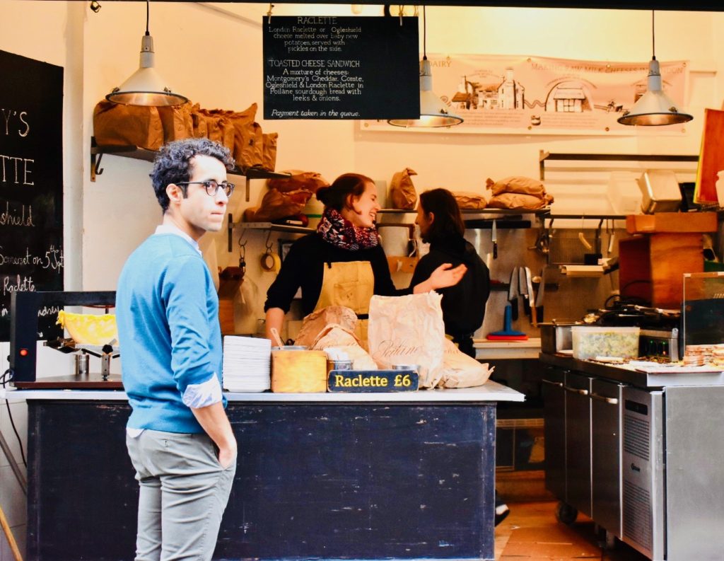 People at a food stand in London remind a writer that travel tips and travel advice don’t outrank personal travel discoveries. (Image © Joyce McGreevy)