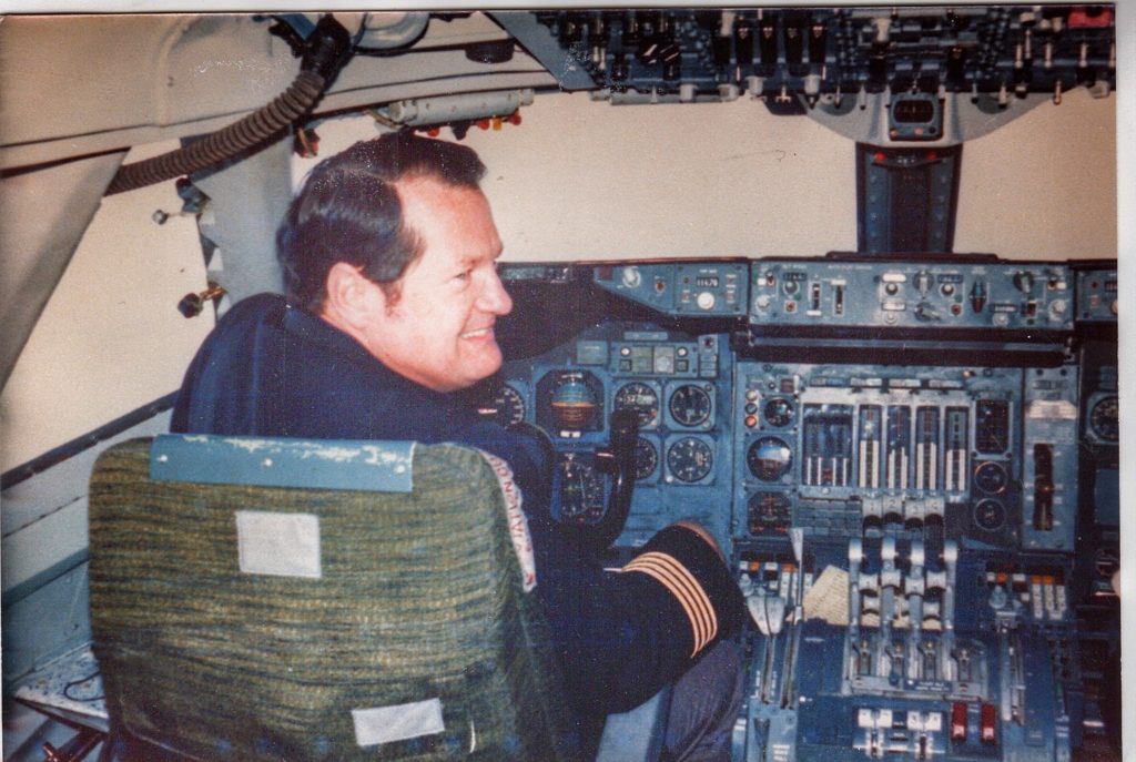 A Trans World Airlines pilot in the cockpit evokes travel inspiration. (Image © McGreevy archives)
