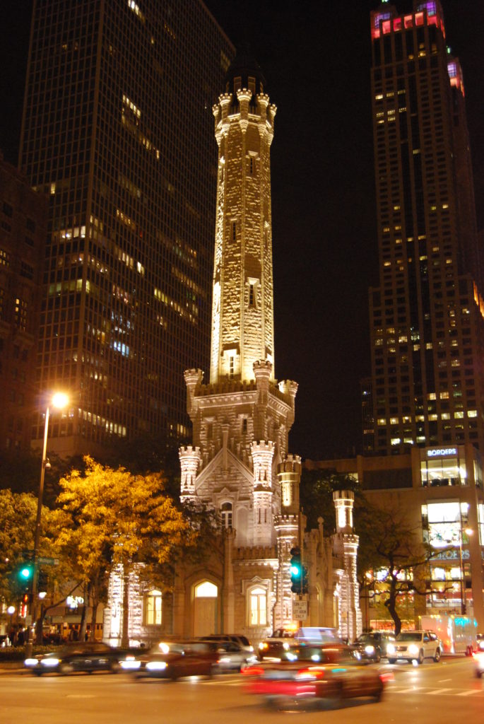 Chicago’s Water Tower is linked to a surprising little detail in a sculpture outside Chicago’s Cultural Center that in turn inspired the travel tip “slow down and focus.” (Public domain image Afries52 [CC BY 3.0] 