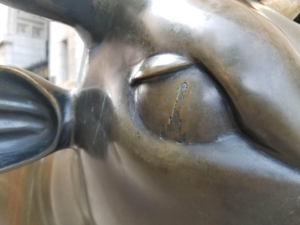 A surprising little detail, Chicago’s Water Tower, in the eye of the bronze cow sculpture at the Chicago Cultural Center evokes the travel tip “slow down and focus.” (Image © by Neil Tobin)