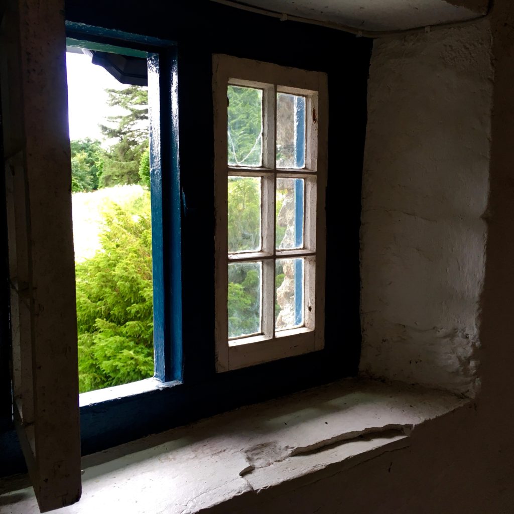 A window in Lismore, Ireland evokes the cross-cultural stories of doors and windows. (Image © Joyce McGreevy)