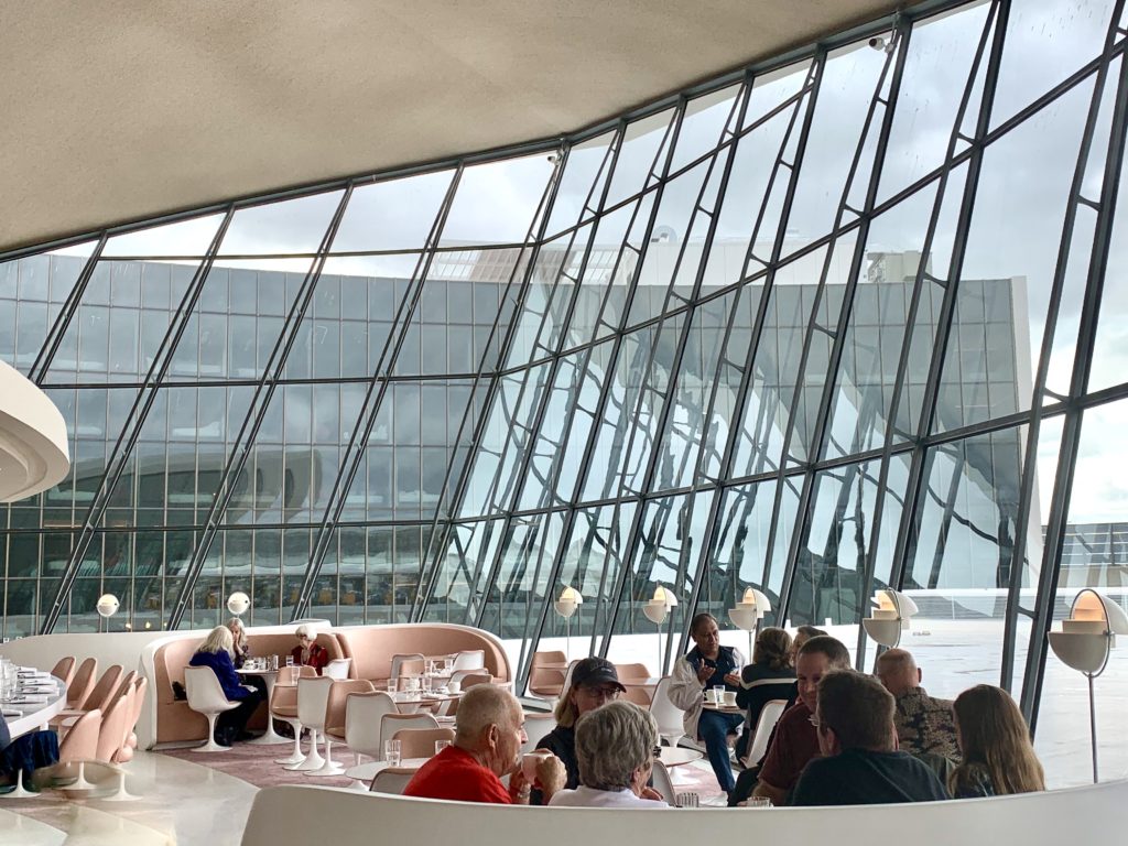 The restored Paris Cafe at The TWA Hotel, JFK Airport New York, evokes travel memories of Trans World Airlines. (Image © Joyce McGreevy)