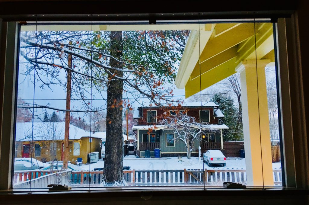 A winter street scene in Bend, Oregon evokes the cross-cultural stories of doors and windows. (Image © Joyce McGreevy)