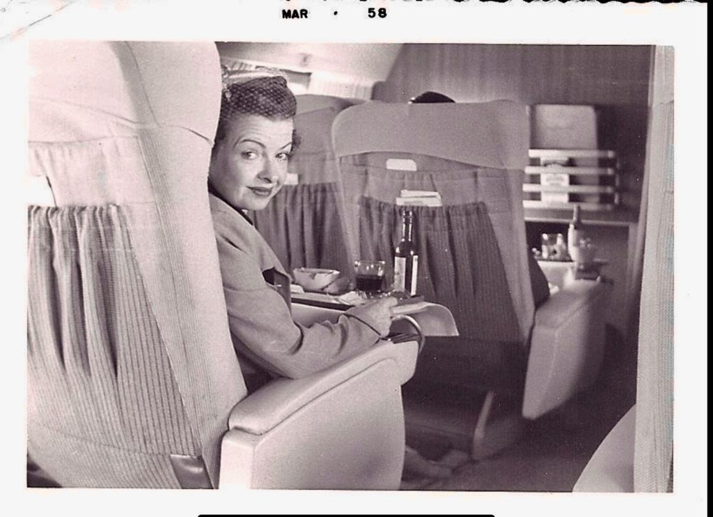 Helen Collins McGreevy on board a Trans World Airlines Constellation, or “Connie,” in 1958 evokes travel memories of the glamour of TWA. (Image @ McGreevy Archives/ Margie Cozad McGreevy and Joyce McGreevy)