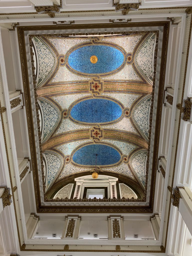 The mosaic ceiling by Louis Comfort Tiffany at the former Marshall Field, Chicago (now Macy’s) inspires the travel tip “slow down and focus” in America’s Best Big City. (Image © by Joyce McGreevy)