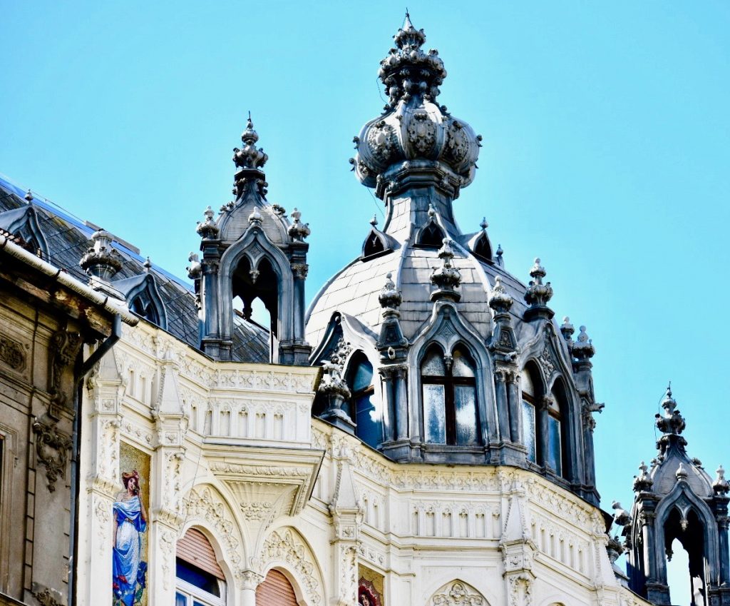 Ornate architecture in Budapest, Hungary inspires a travel tip: take time to notice the details. Image © Joyce McGreevy