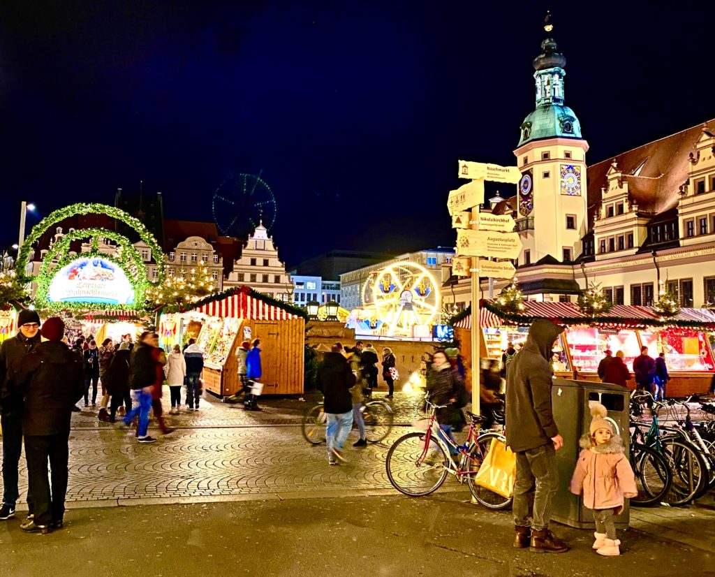 People at the Leipziger Weihnachtsmarkt, the annual Christmas market in Leipzig, celebrate centuries-old German Christmas traditions. (Image © Joyce McGreevy)