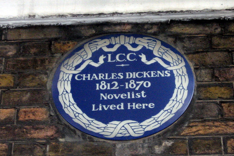 An historical marker, one of London’s blue plaques, identifies Charles Dickens’ home on Doughty Street near the Foundling Hospital, a charity that influenced his novel Oliver Twist. (public domain image by Wally Gobetz) 