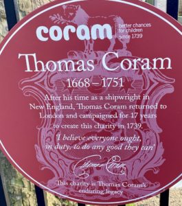 A historical marker tells the story of British sea captain Thomas Coram, who campaigned to create London’s first charity for children, overcoming widespread prejudice about children born into poverty or outside of marriage. (Image © Joyce McGreevy)