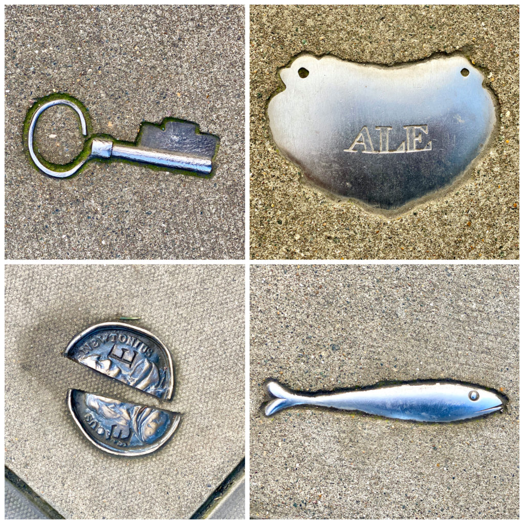 An array of silver charms seen on Marchmont Street are evocative markers of Britain’s past, inspired by historical tokens at London’s Foundling Museum. (Image © Joyce McGreevy)