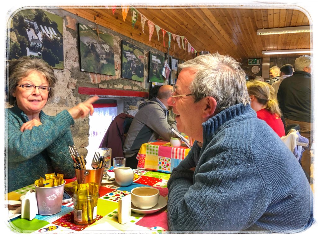 A man and woman dining in Ireland embody the concept of mindful travel and First-Class travel on a budget. (Image © Joyce McGreevy) 