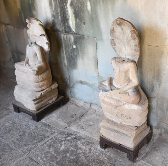 Headless statues at Angkor Wat in Siem Reap, Cambodia, one of the Angkor temples in one of the most amazing places on earth. (Image © Meredith Mullins.)