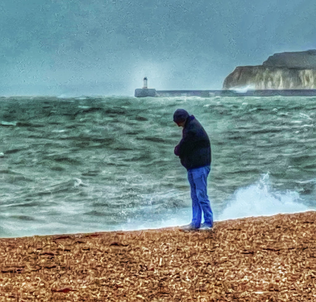 An intrepid traveler on a beach in East Sussex, England is proof of the power of wanderlust over the forces of winter’s chill. (Image © Joyce McGreevy)