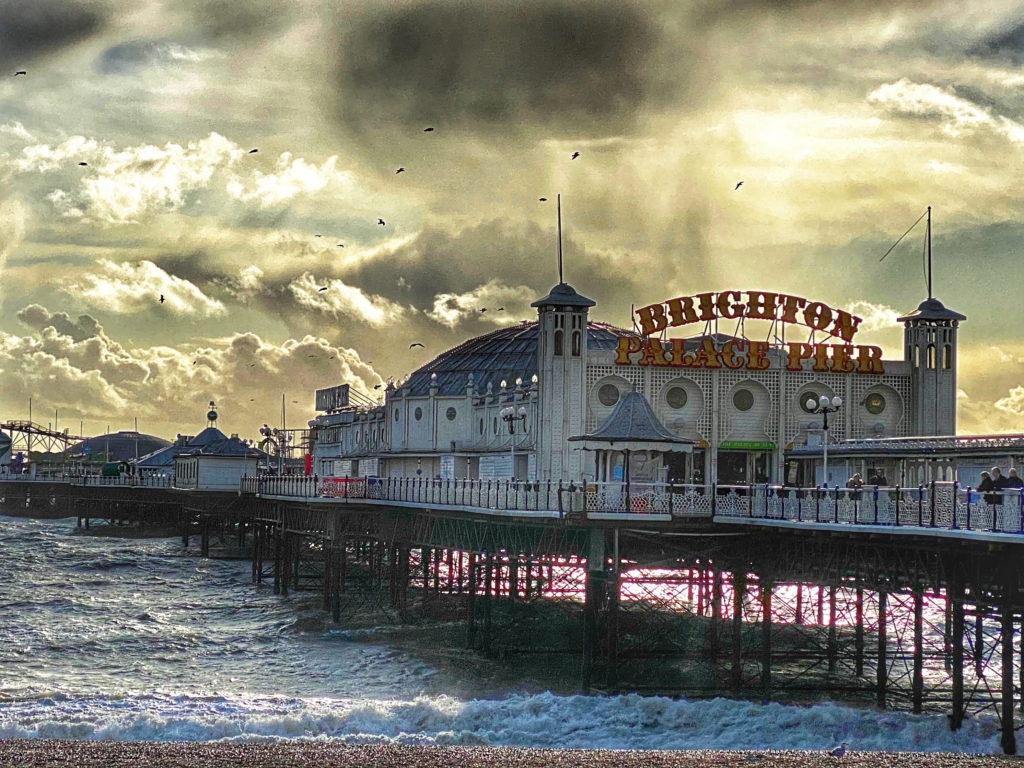 Brighton Palace Pier in winter has an eerie magic that inspires wanderlust to travel to East Sussex, England in the off season. (Image © Joyce McGreevy)