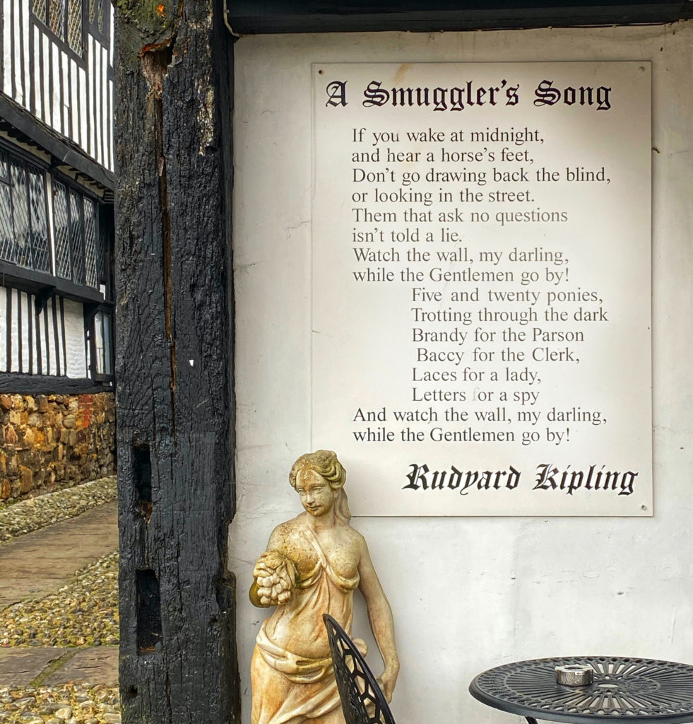 The lyrics of Rudyard Kipling’s “A Smuggler’s Song” on a wall in East Sussex reflect the turbulent history of England’s South Coast. (Image © Joyce McGreevy)