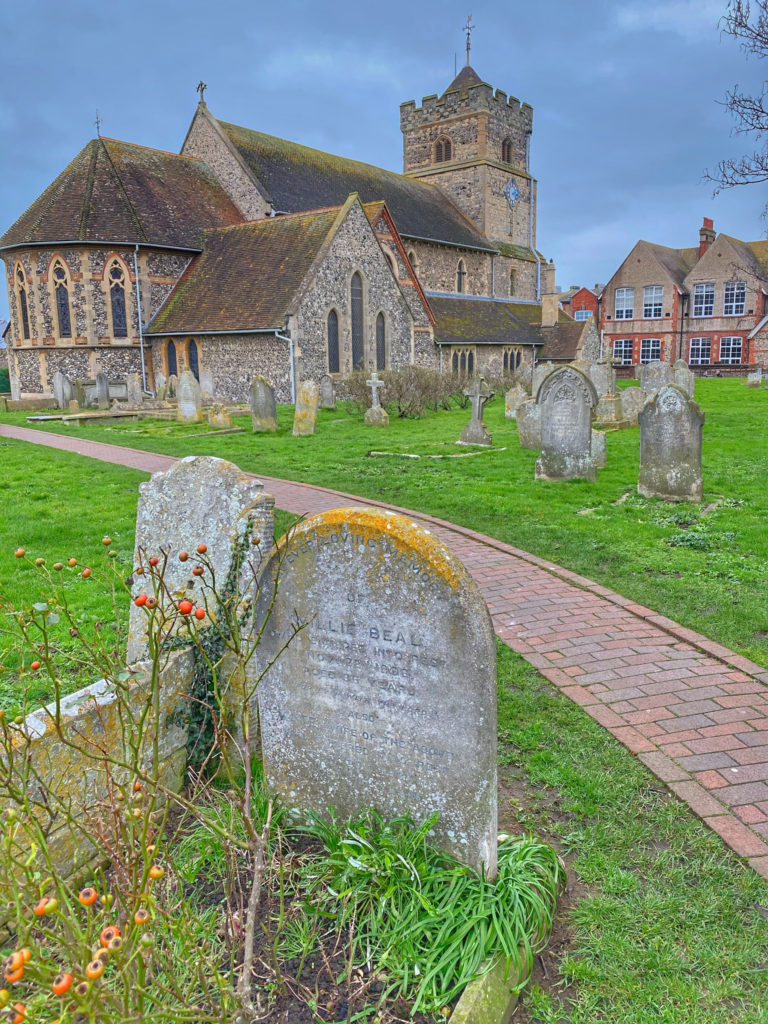A churchyard in Seaford, East Sussex evokes the contrast between the tranquility of the setting and the turbulence of the local history. (Image © Joyce McGreevy)