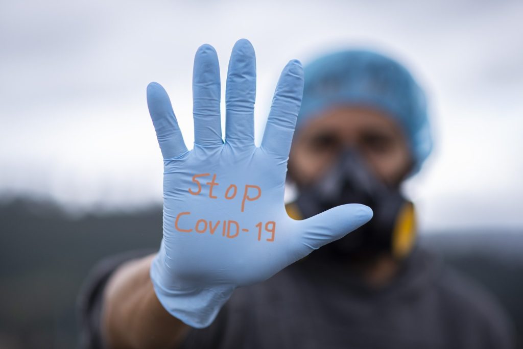 A man in PPE evokes the Australian proverb, "Heavy givers are light complainers,” a cultural saying turned quarantine quote because it now applies to brave medical responders and other essential workers during the pandemic. Image by Pixabay/Fernando Zhiminaicela