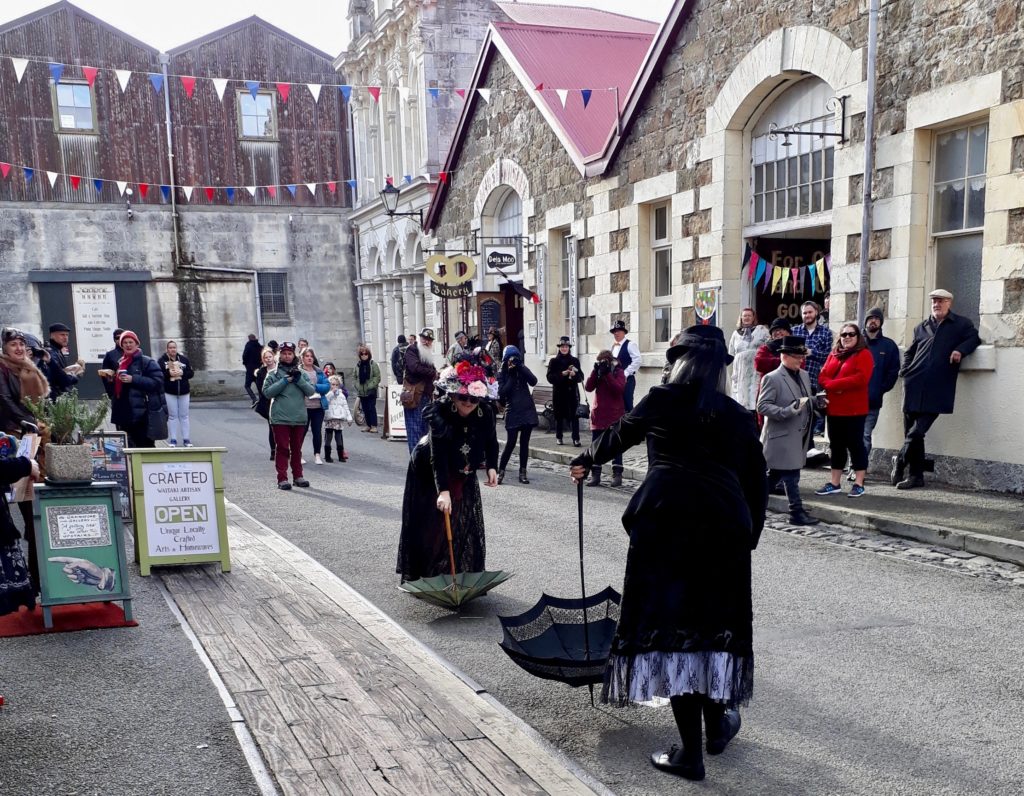 Parasol duelists and crowds enjoy Steampunk Festival NZ, which celebrates the Victorian cultural heritage and creative thinking of Oamaru, New Zealand. (Image © Janet Doyle)