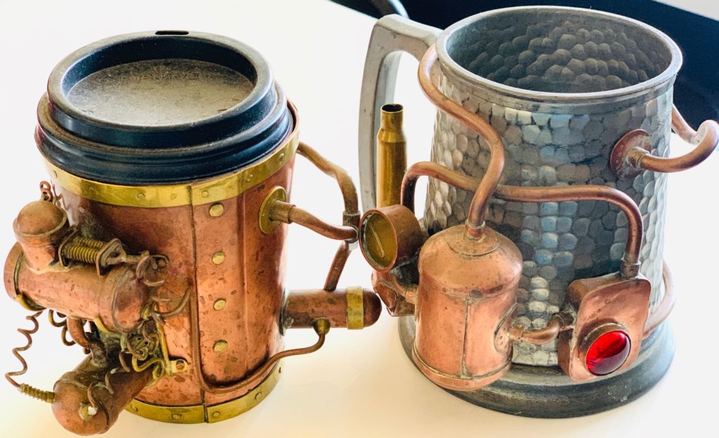 Two steampunk mugs created by Iain Clark, manufacturing jeweler and organizer of Steampunk Festival NZ, which celebrates the Victorian cultural heritage and steampunk creative thinking of Oamaru, New Zealand. (Image © Joyce McGreevy)