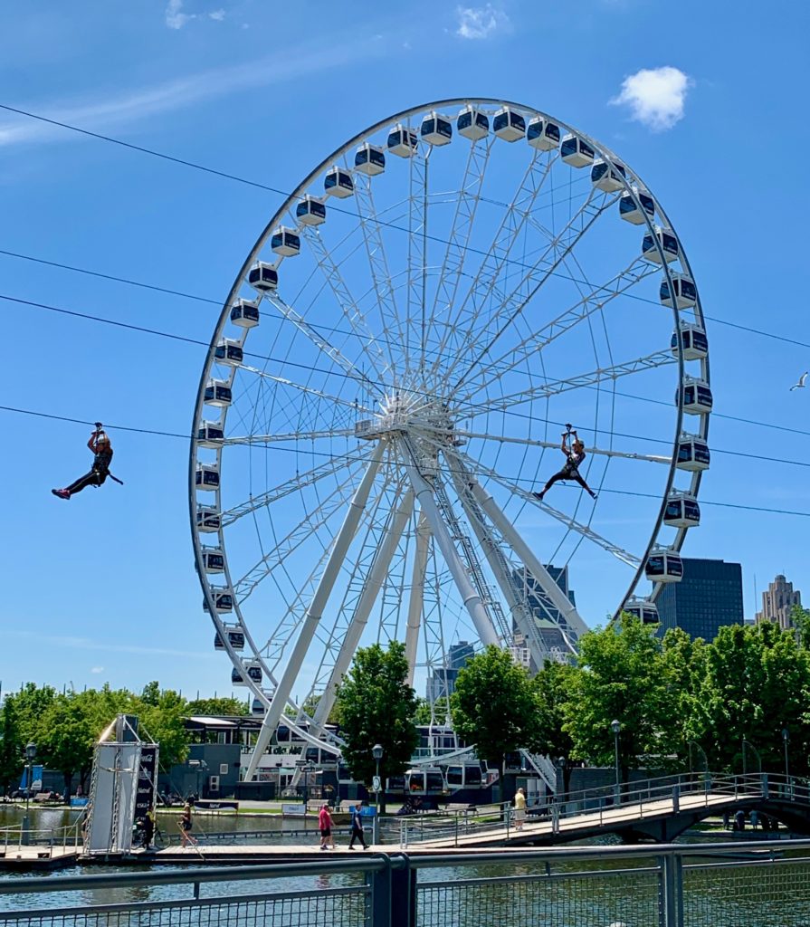 A zip line and Ferris wheel in Montréal suggest that slowing down and broadening your focus are additional ways to explore the urban culture. (Image © Joyce McGreevy)
