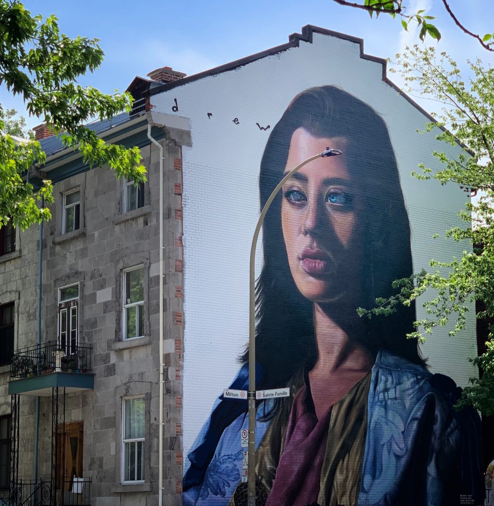 Public street art on Rue St-Famille, Montréal reflects the everyday pleasure of exploring the urban culture. (Image © Joyce McGreevy)