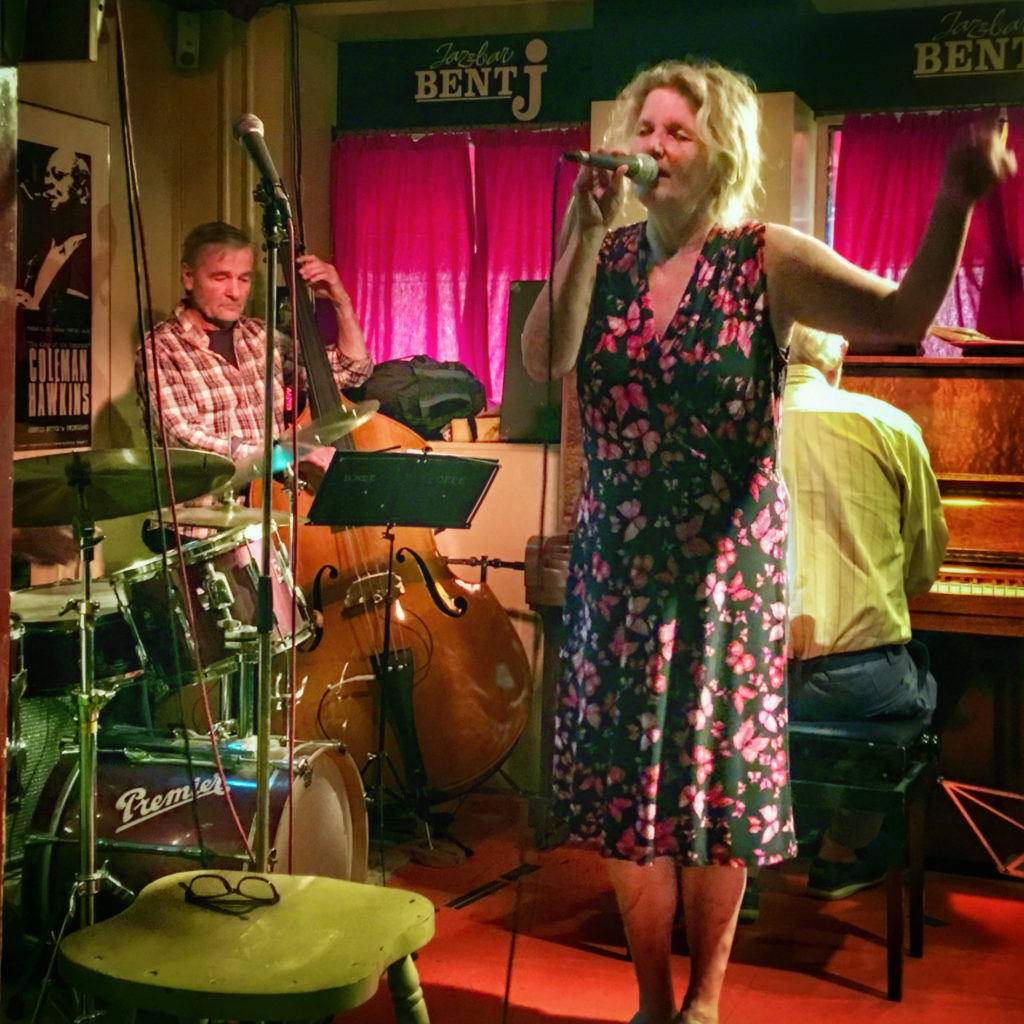 A jazz trio in Denmark symbolize why travel memories inspired by music make us feel as if we are re-living, not just recalling, an experience. (Image © by Joyce McGreevy)