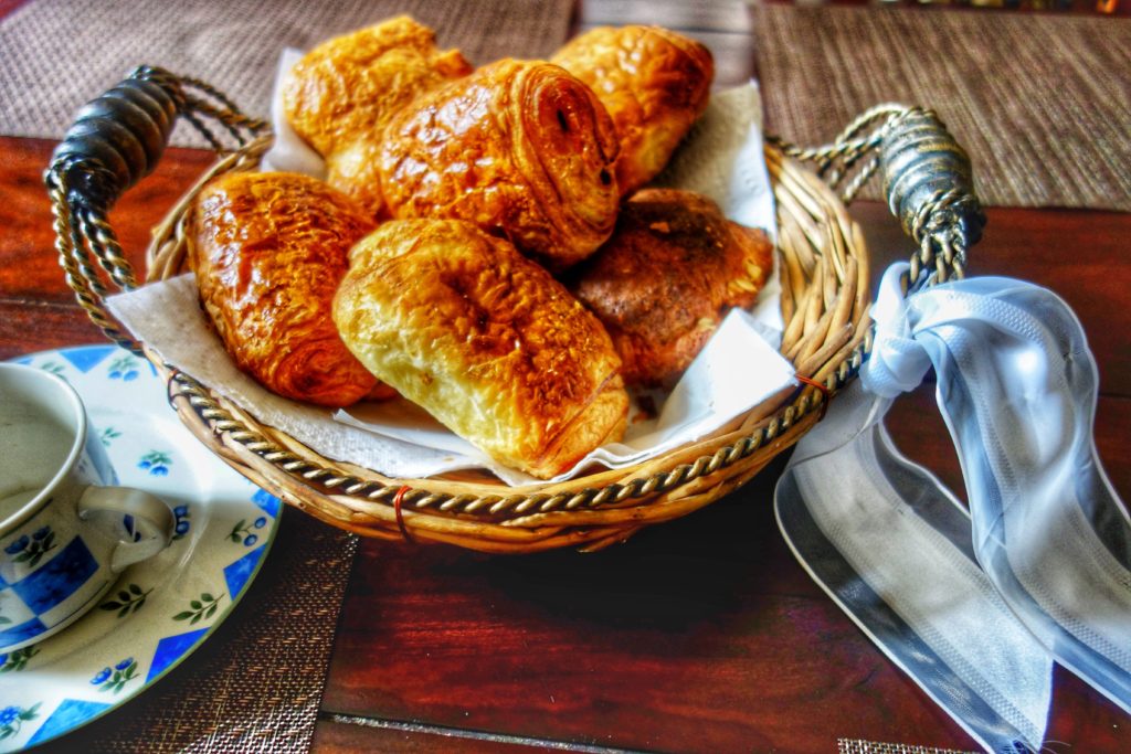 A basket of croissants symbolizes the way travel memories inspired by music often include vivid sensory details. (Image © by Joyce McGreevy)