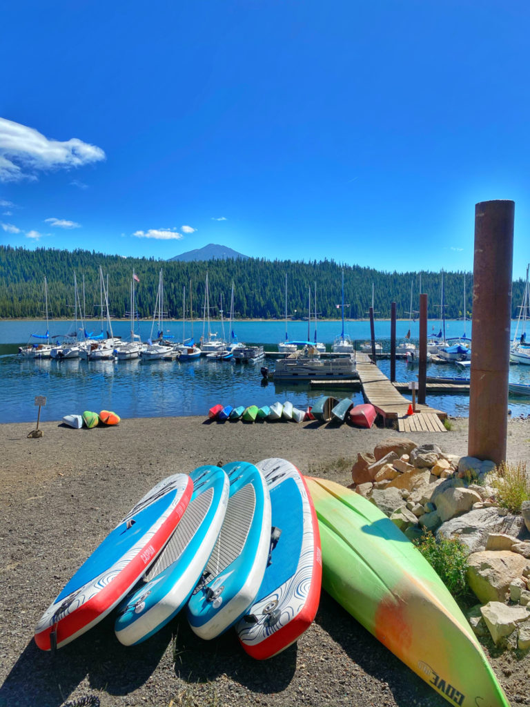 Floats and kayaks at Elk Lake, Oregon figure in the author’s personal celebration of blue spaces and inspire her interest in personal and cultural beliefs about water, including the blue mind theory. (Image © Joyce McGreevy)