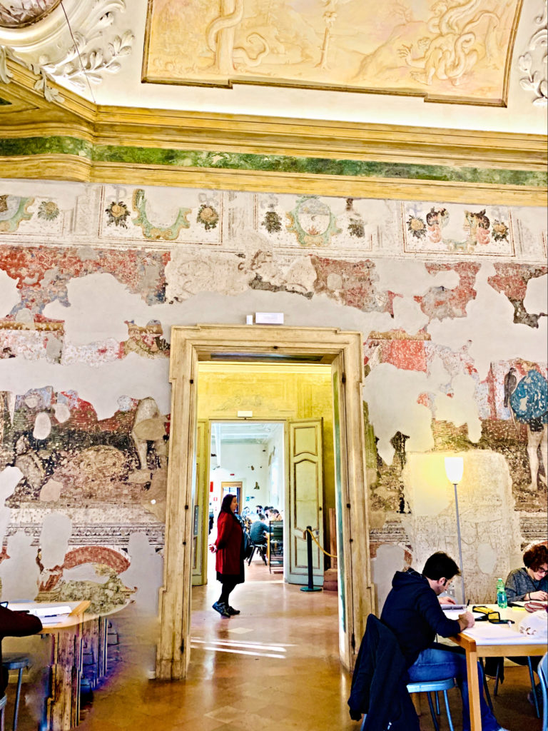 Students in am ancient college library in Italy remind a remote learner to make math connections across cultures, such as to the Italian lattice method of multiplication. (Image © Joyce McGreevy)