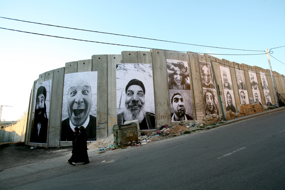 Face 2 Face, the work of artivist JR artist, in the West Bank of Palestine, showing social awareness and answering the question can art change the world. (Image © JR.)