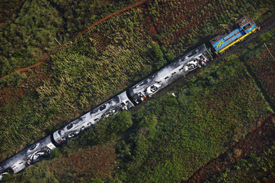 A train in Kenya with the work of Artivist JR Artist, showing cultural diversity, social awareness, and answering the question can art change the world. (Image © JR.)