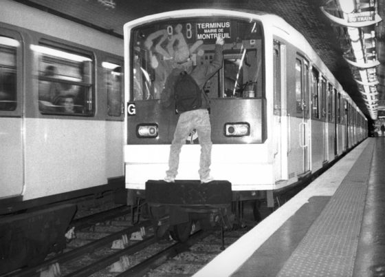 Artivist JR's Graffiti artist painting on a metro car, showing cultural diversity, social awareness, and answering the question can art change the world. (Image © JR.)